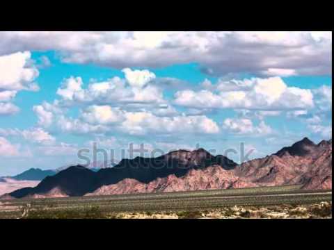 time lapse beautiful clouds moving over mountain range